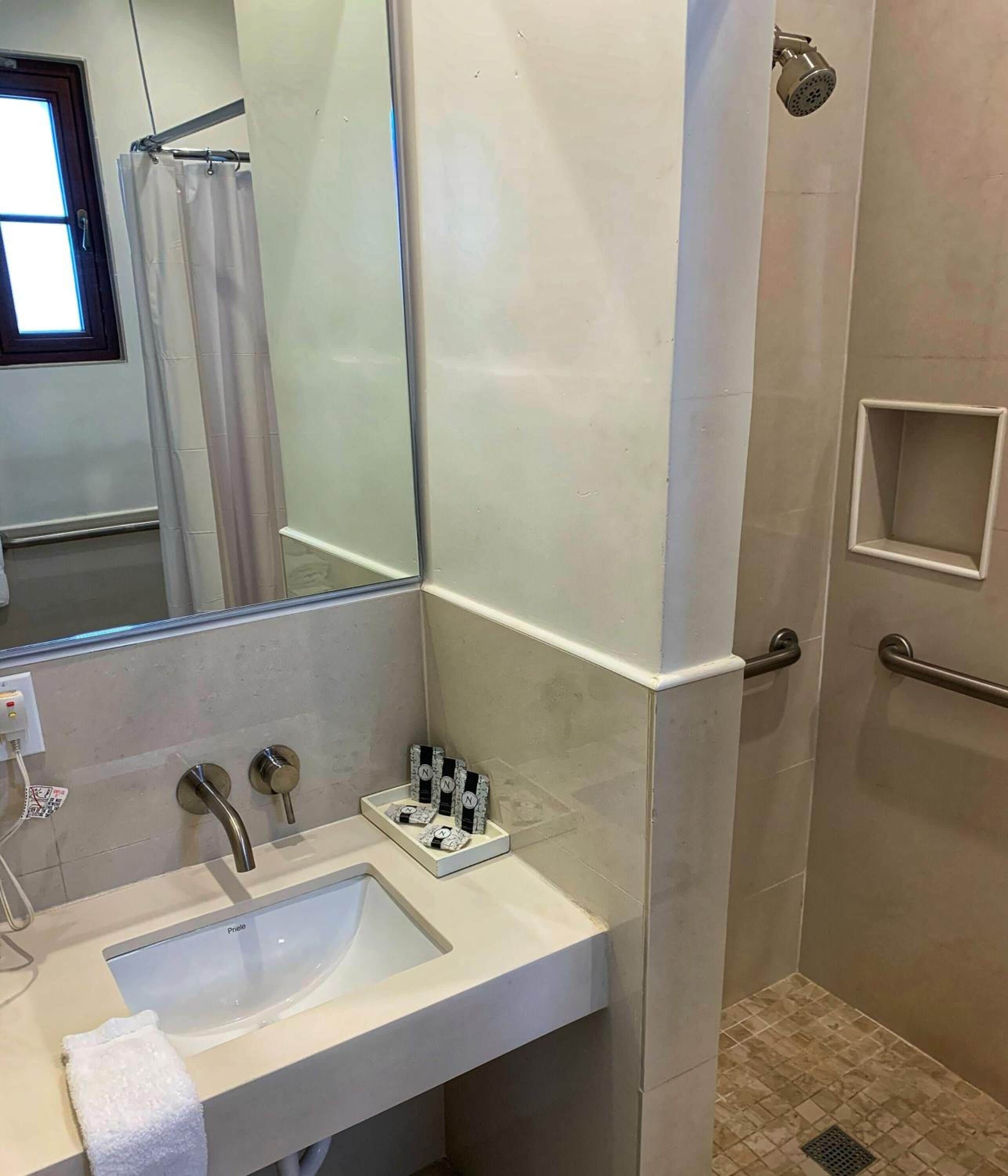 rainfall showerhead, designer toiletries, hair dryer, towels