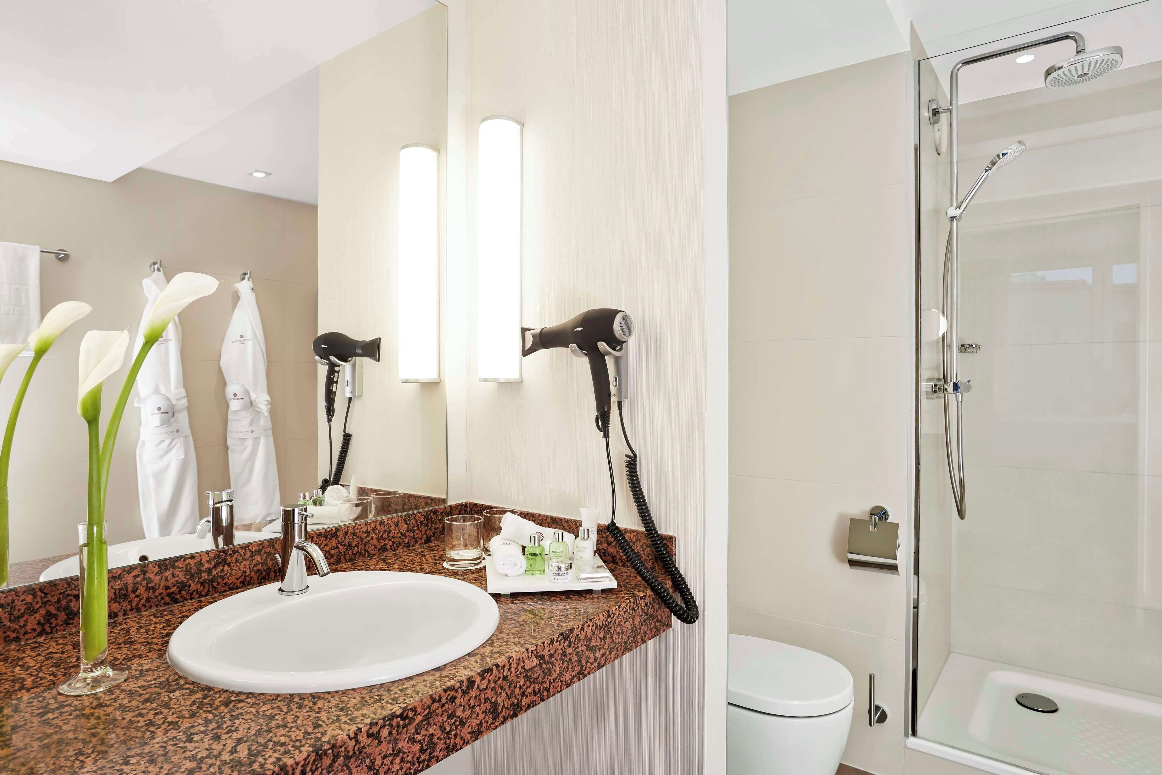 shower, eco-friendly toiletries, hair dryer, bathrobes