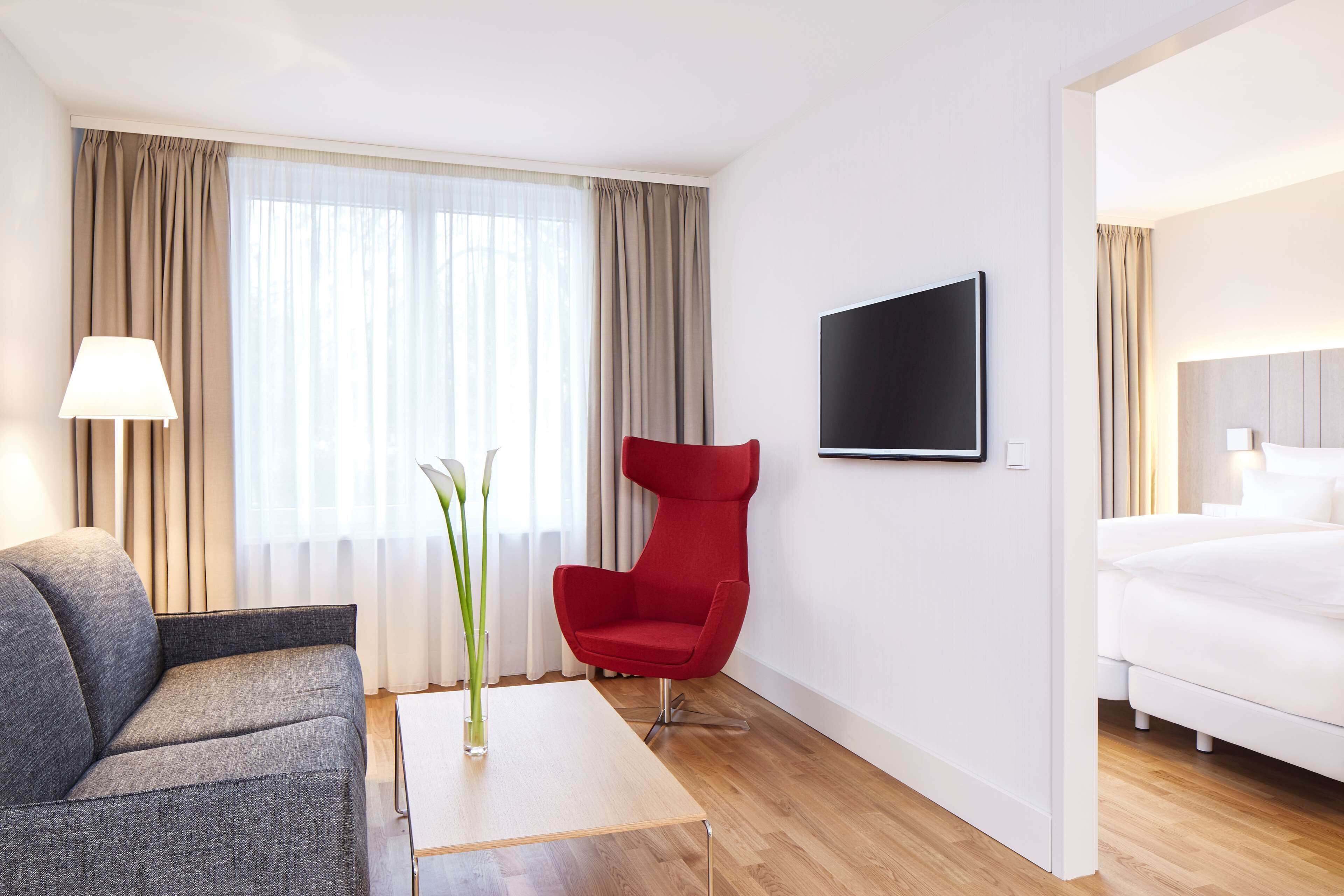 family room | premium bedding, minibar, in-room safe, desk