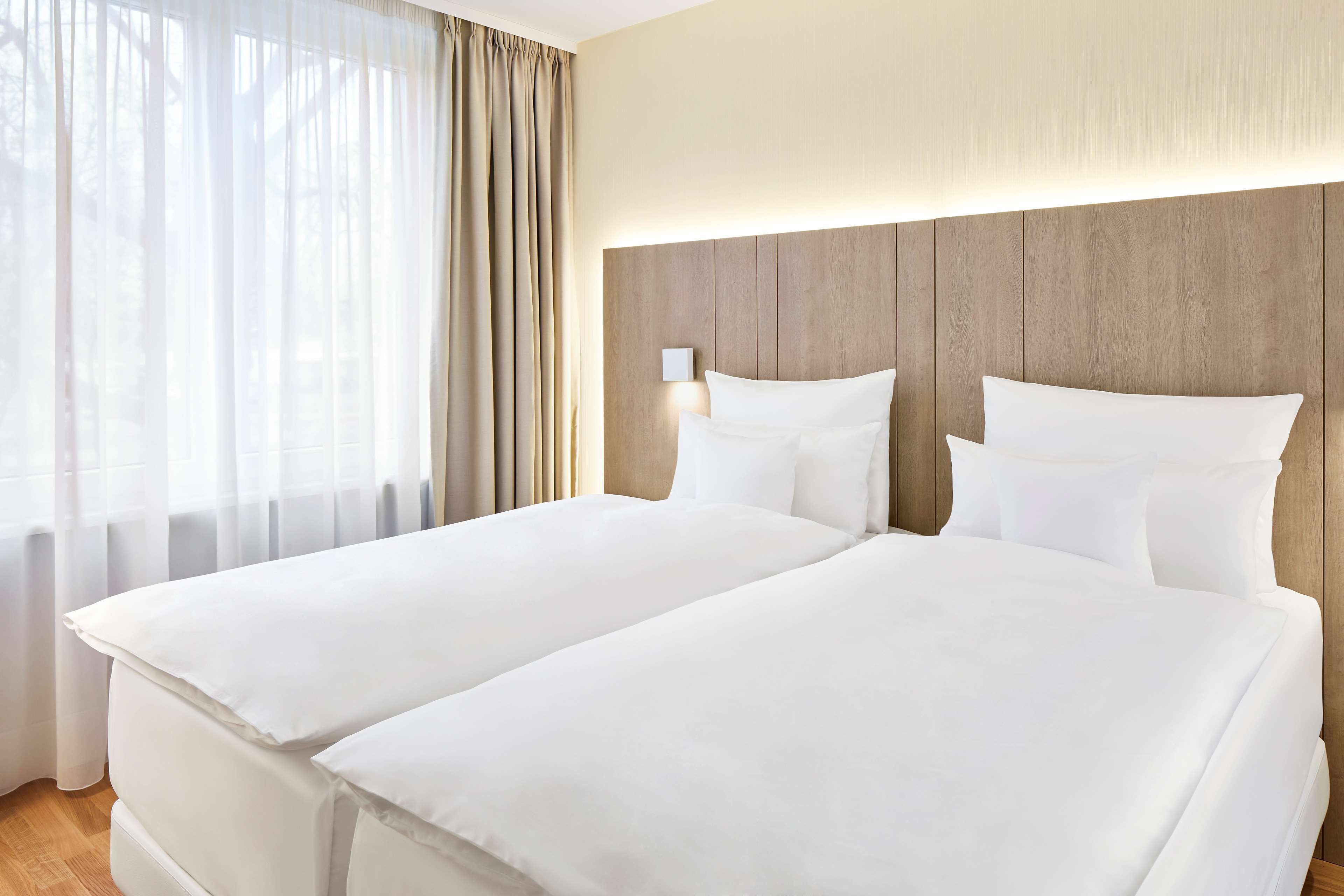 family room | premium bedding, minibar, in-room safe, desk