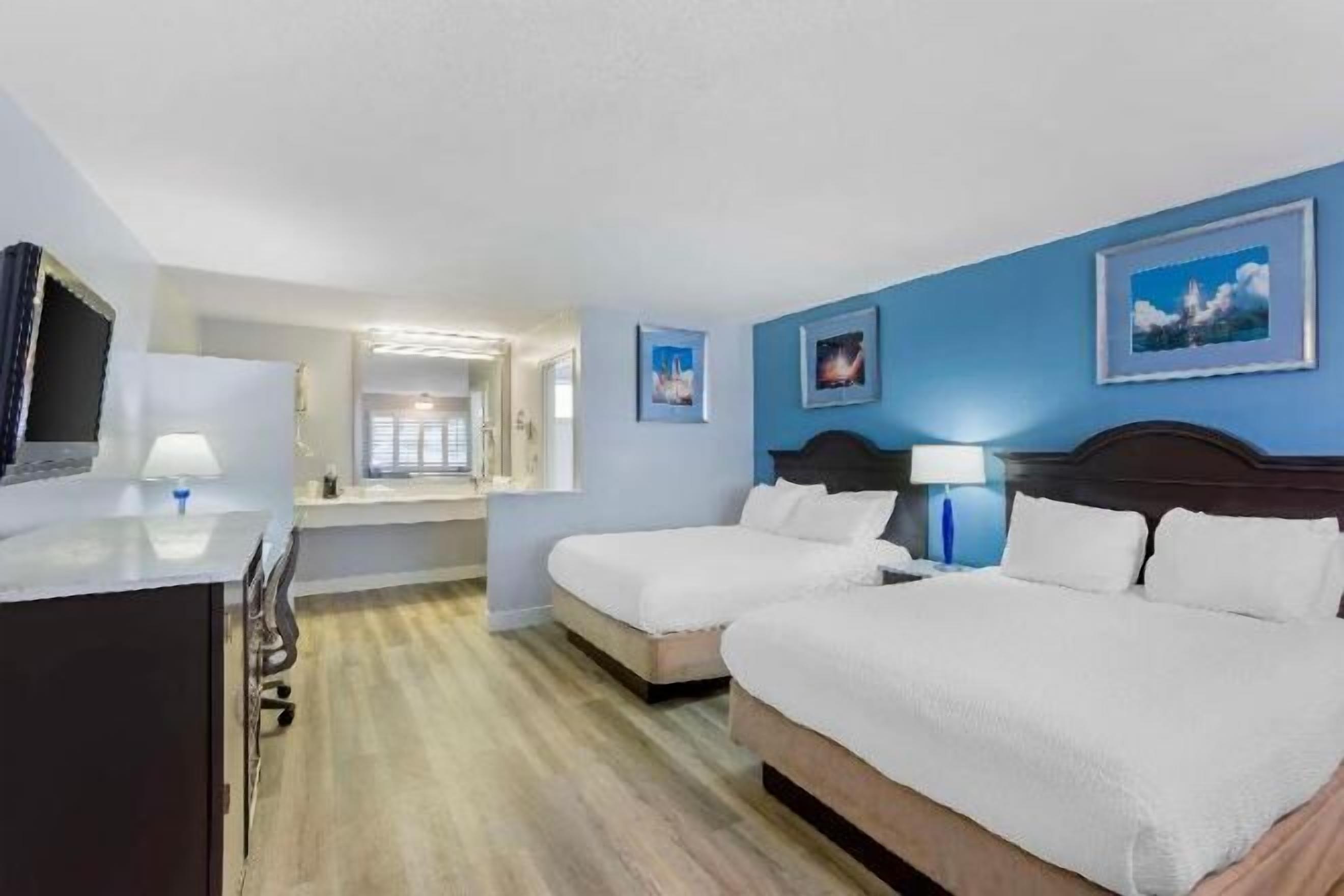 Pillow-top beds, desk, laptop workspace, blackout curtains