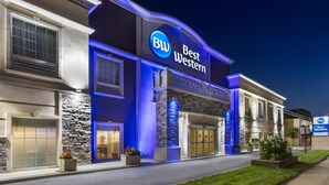A hotel with a prominent 'BW Best Western' sign, a stone facade, and a well-lit entrance. - Best Western Bar Harbour Inn (Massapequa Park)