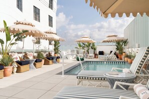 Outdoor pool, open 7 AM to 6:00 PM, free cabanas