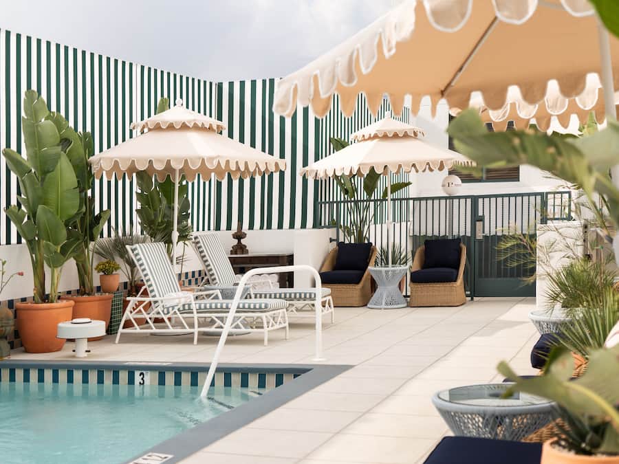 Outdoor pool, open 7 AM to 6:00 PM, free pool cabanas