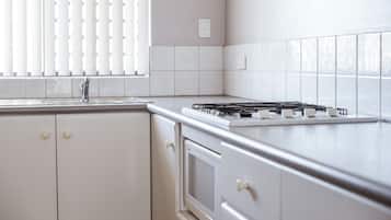 Two Bedroom Apartment | Private kitchen | Fridge, stovetop, dishwasher, electric kettle