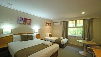 Triple Room | Minibar, laptop workspace, blackout curtains, iron/ironing board