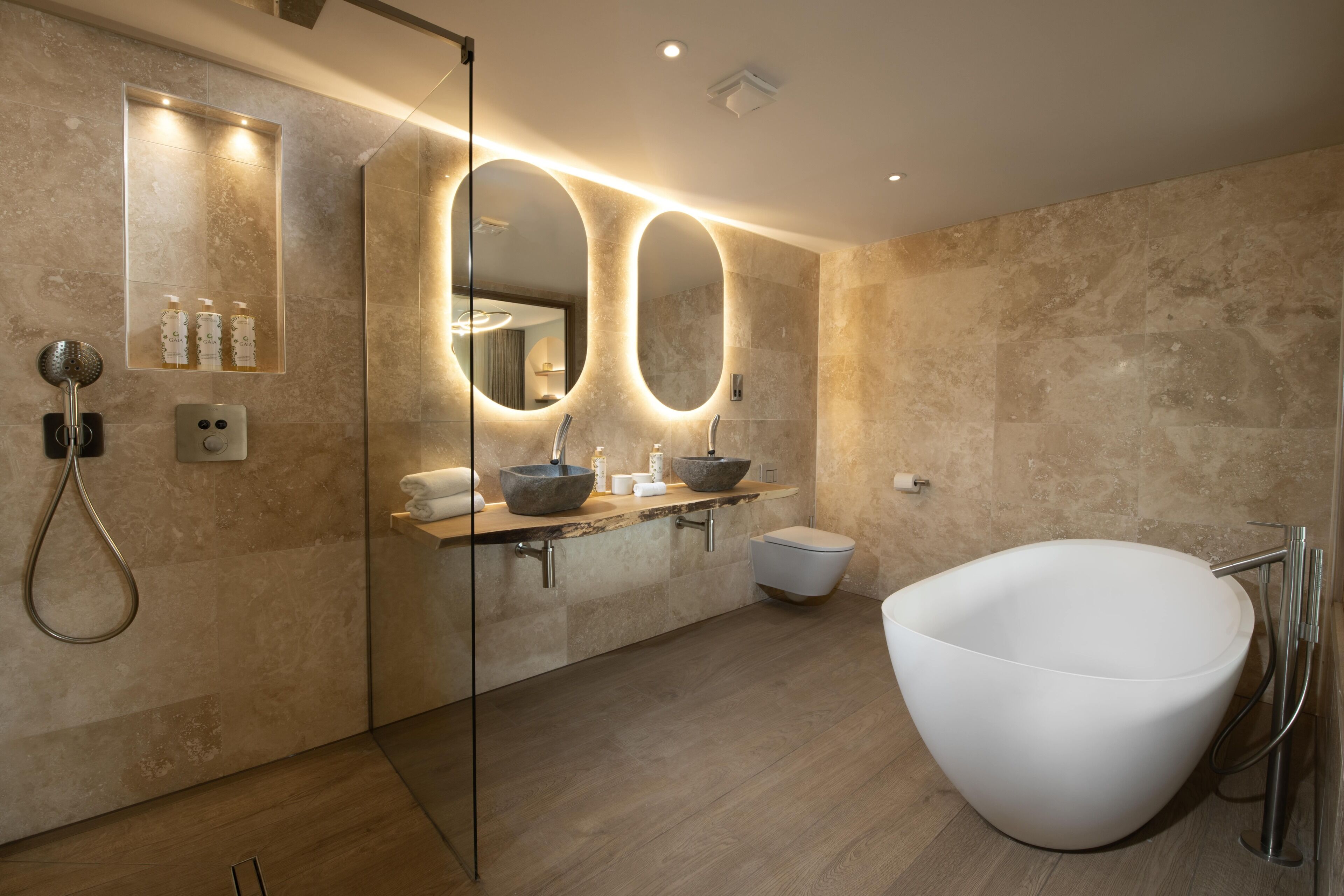 deluxe studio suite | bathroom | separate bathtub and shower, deep-soaking bathtub, designer toiletries