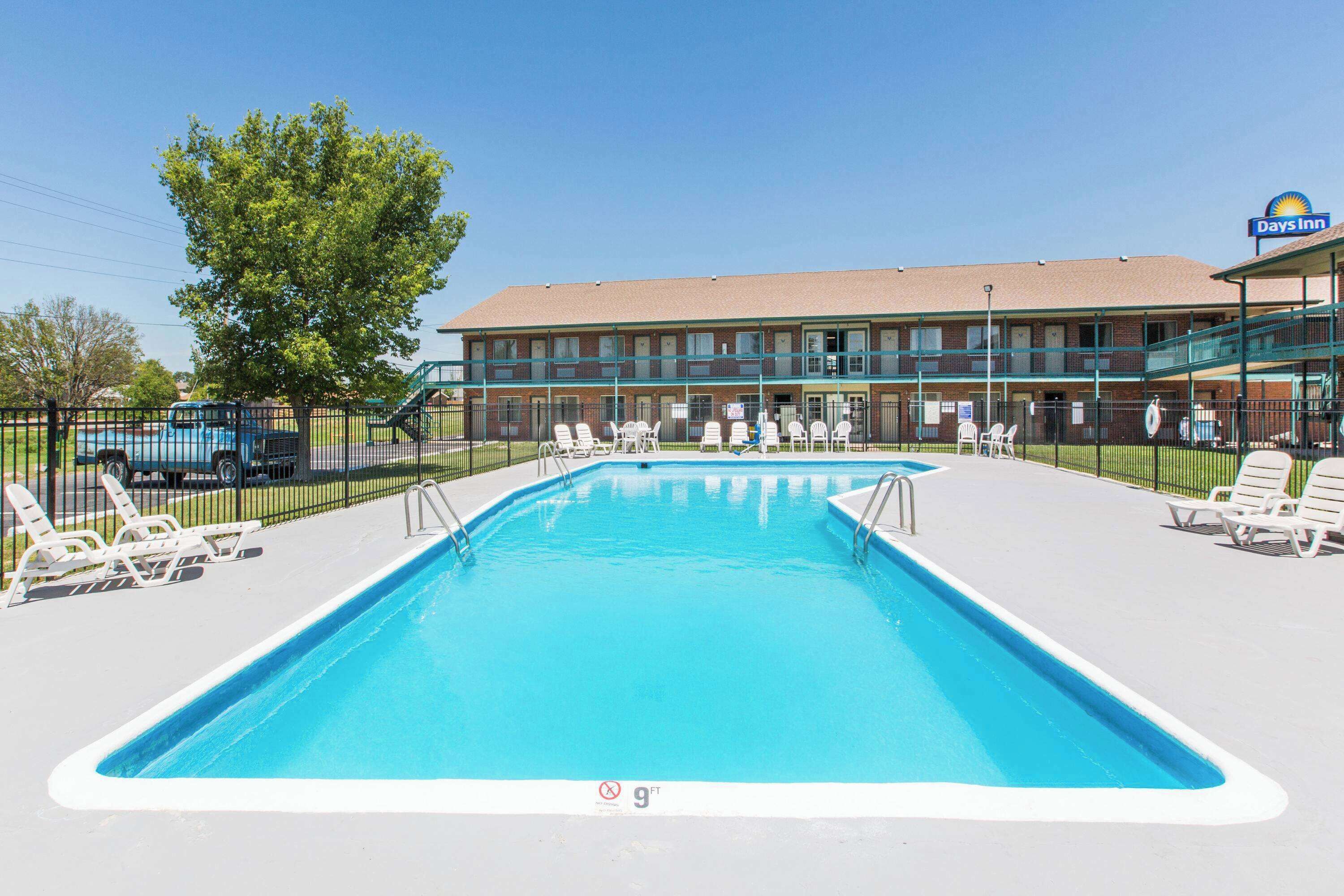 Seasonal outdoor pool, open 9:00 AM to 9:00 PM, pool loungers