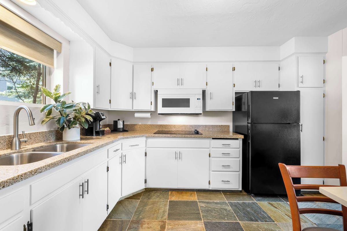 suite, multiple beds, kitchen, river view | 1 bedroom, individually decorated, individually furnished, desk