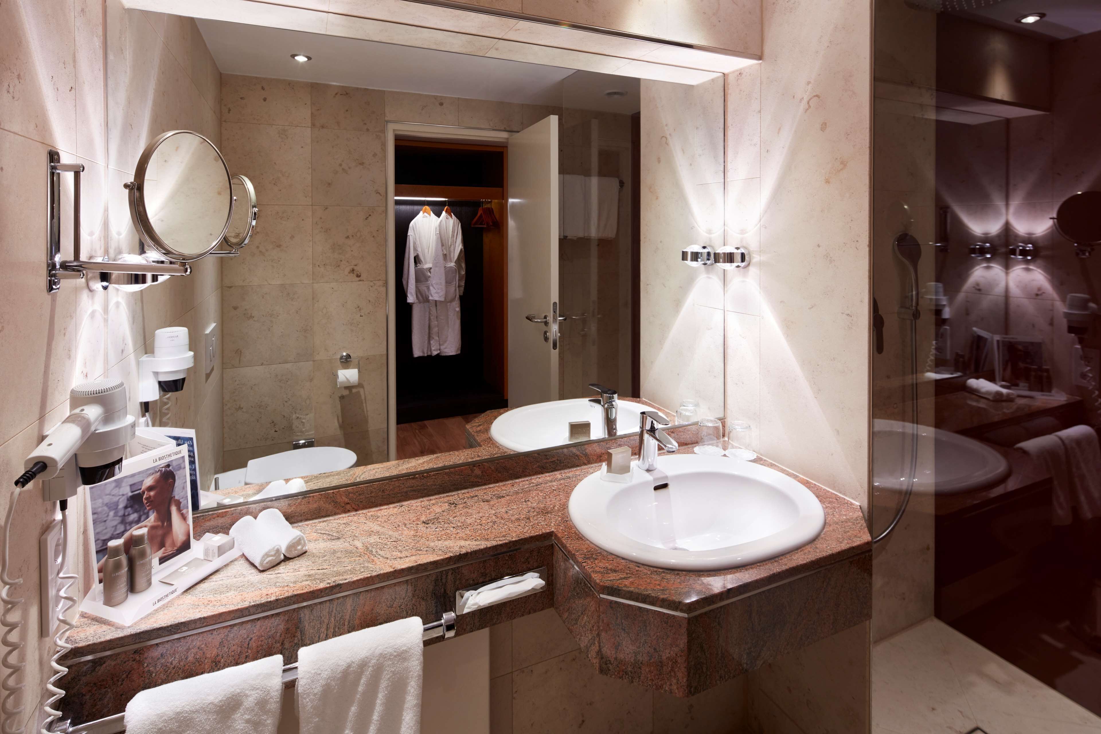 shower, hair dryer, bathrobes, slippers