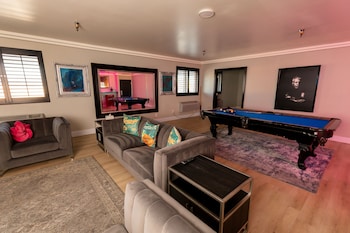 Lexi Suite | Living area | 56-inch Smart TV with satellite channels at Lexi Las Vegas