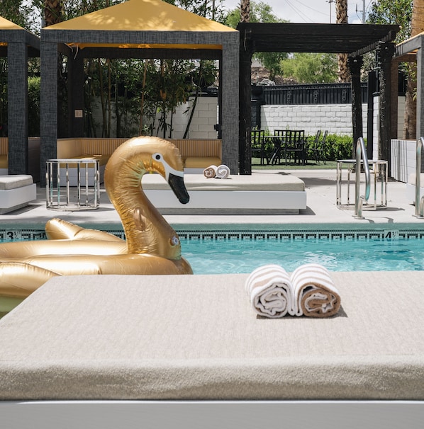 Outdoor pool, open 10:00 AM to 7:00 PM, cabanas (surcharge)