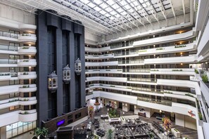 A multi-level atrium with balconies, seating areas, and a central open space. - Embassy Suites by Hilton Los Angeles International Airport North (Los Angeles)