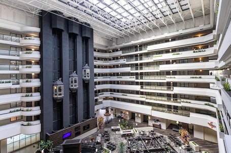 A multi-level atrium with balconies, seating areas, and a central open space.