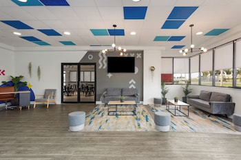 Sitting area in hotel lobby at Baymont by Wyndham Orlando North Millenia