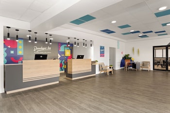 Hotel entrance and lobby at Baymont by Wyndham Orlando North Millenia