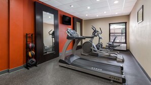 A gym with a treadmill, elliptical, and weights. - Best Western Albemarle Inn (Albemarle)
