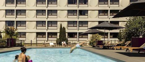 Seasonal outdoor pool, open 9:00 AM to 10:00 PM, pool umbrellas
