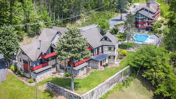 Experience serene living in a forest setting with a luxurious pool and beautifully maintained grounds.
