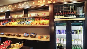 A snack and beverage display with various snacks and drinks.