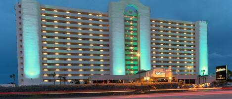 A large hotel with multiple floors and a central entrance.