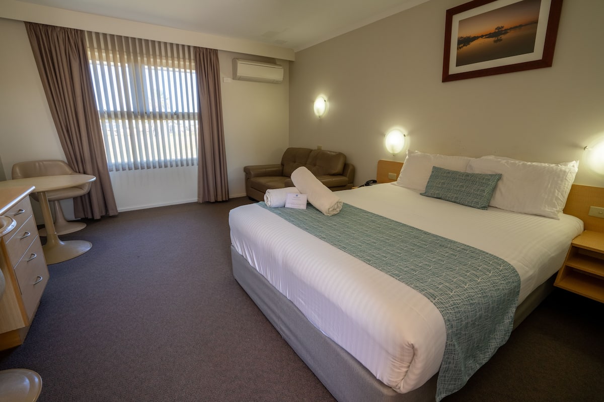Minibar, desk, blackout curtains, iron/ironing board