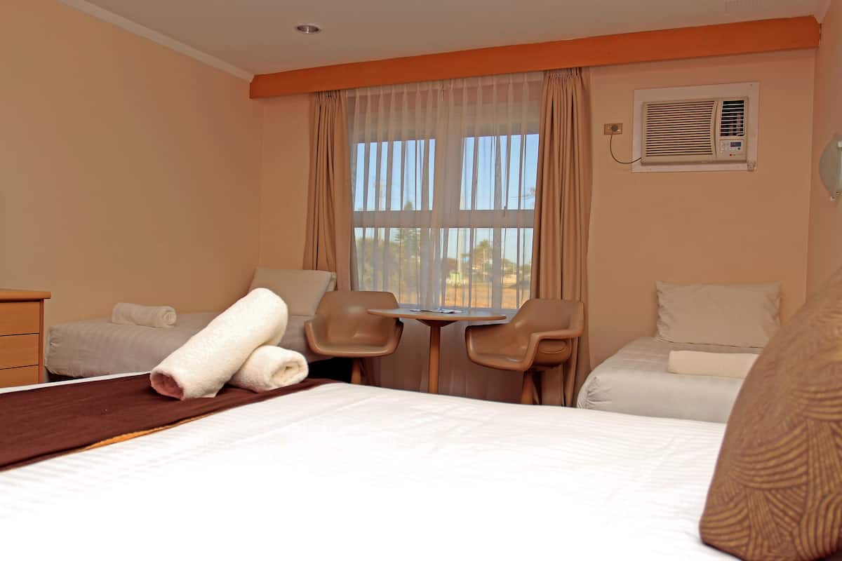 family room | minibar, desk, blackout curtains, iron/ironing board