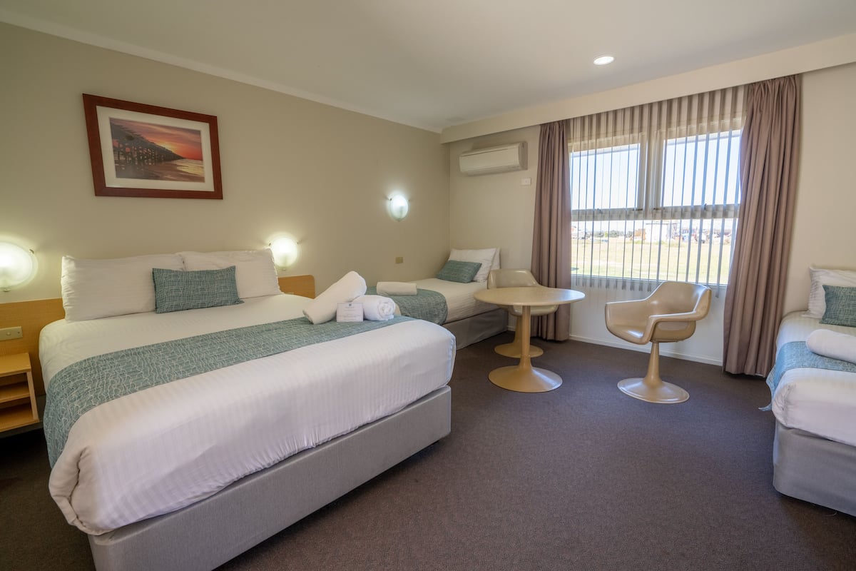 Minibar, desk, blackout curtains, iron/ironing board