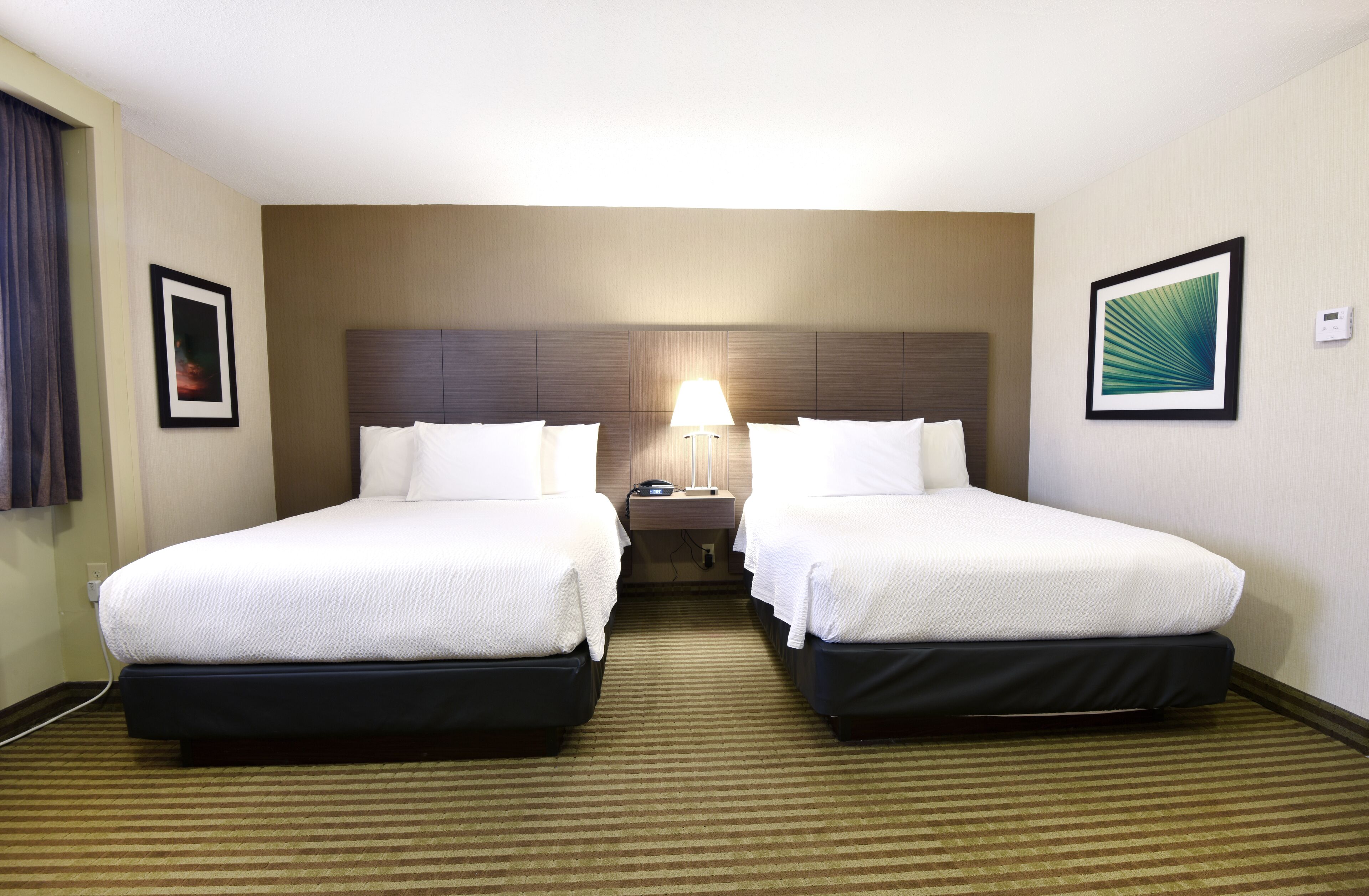 deluxe room, 2 queen beds | premium bedding, pillow-top beds, in-room safe, desk