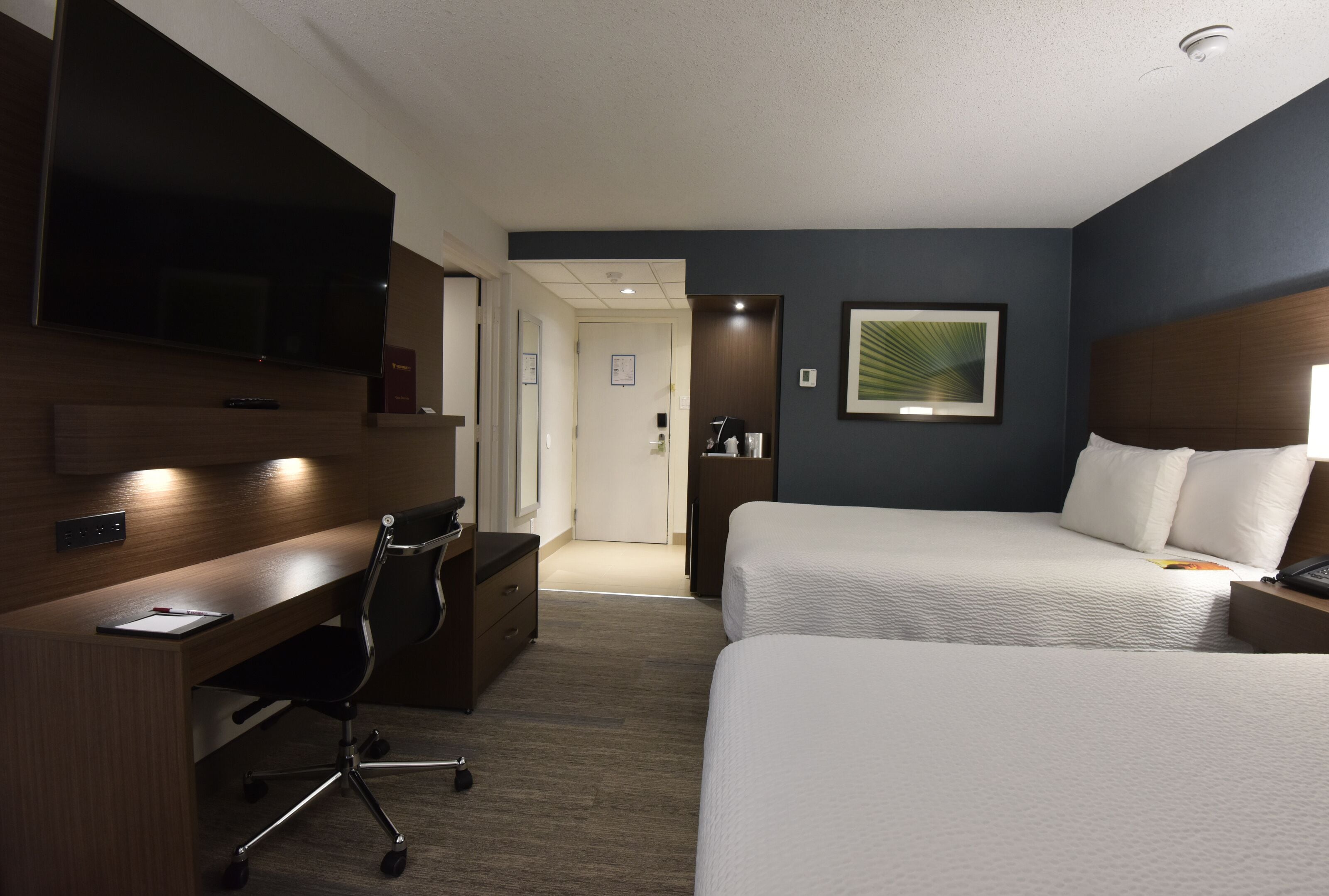 premier room, 2 queen beds | premium bedding, pillow-top beds, in-room safe, desk
