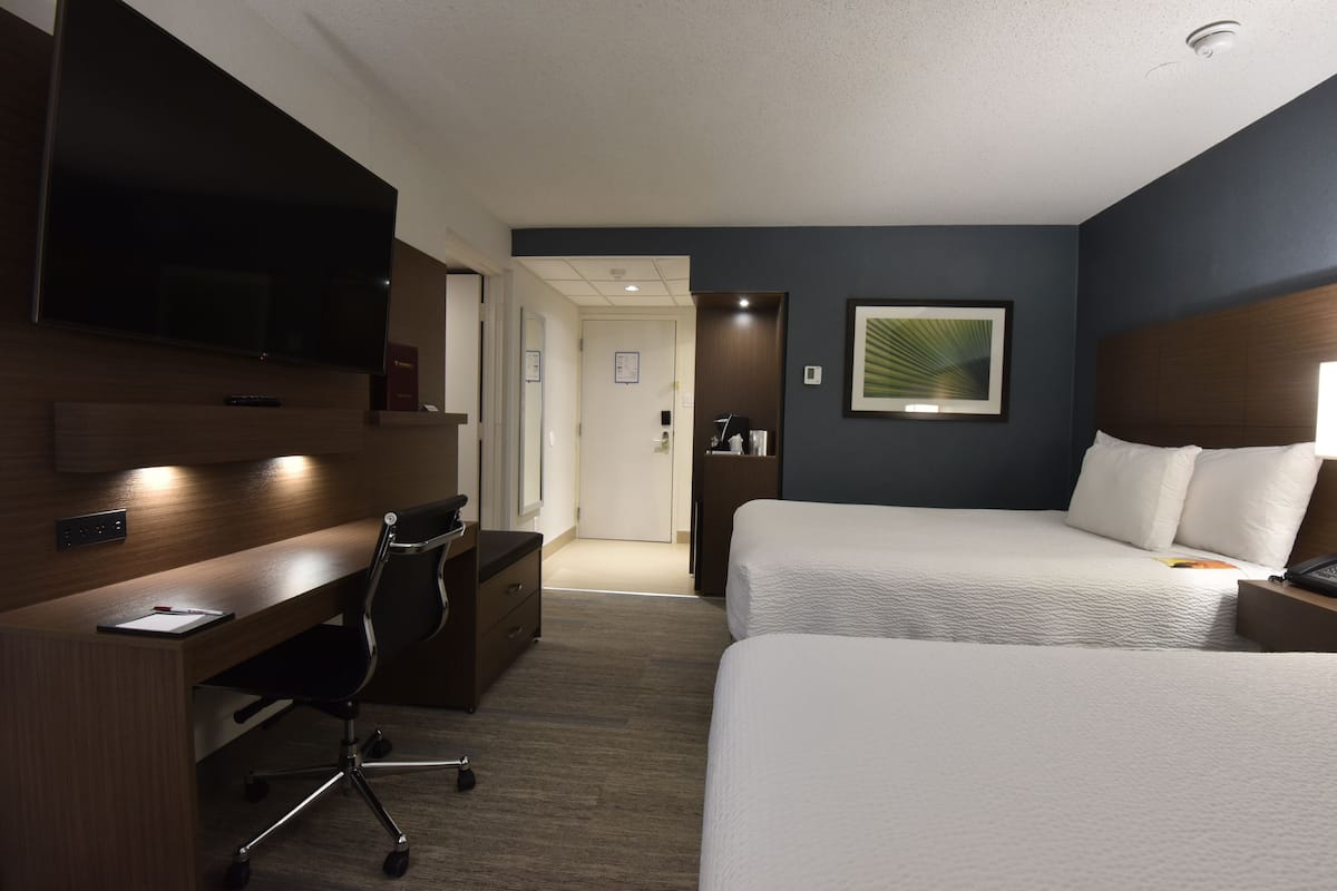 premier room, 2 queen beds | premium bedding, pillow-top beds, in-room safe, desk
