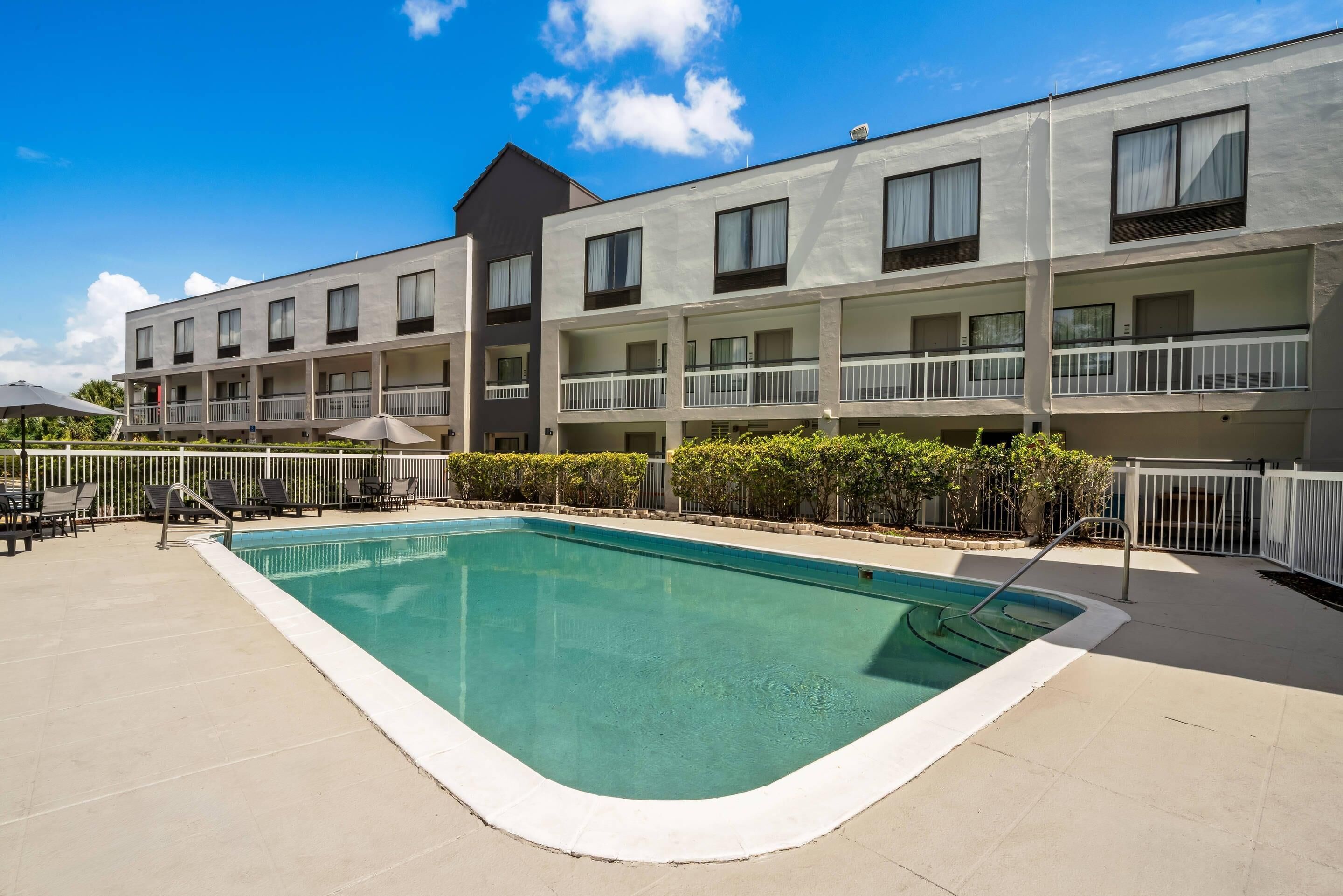 Outdoor pool, open 9:00 AM to 10:00 PM, pool umbrellas, pool loungers