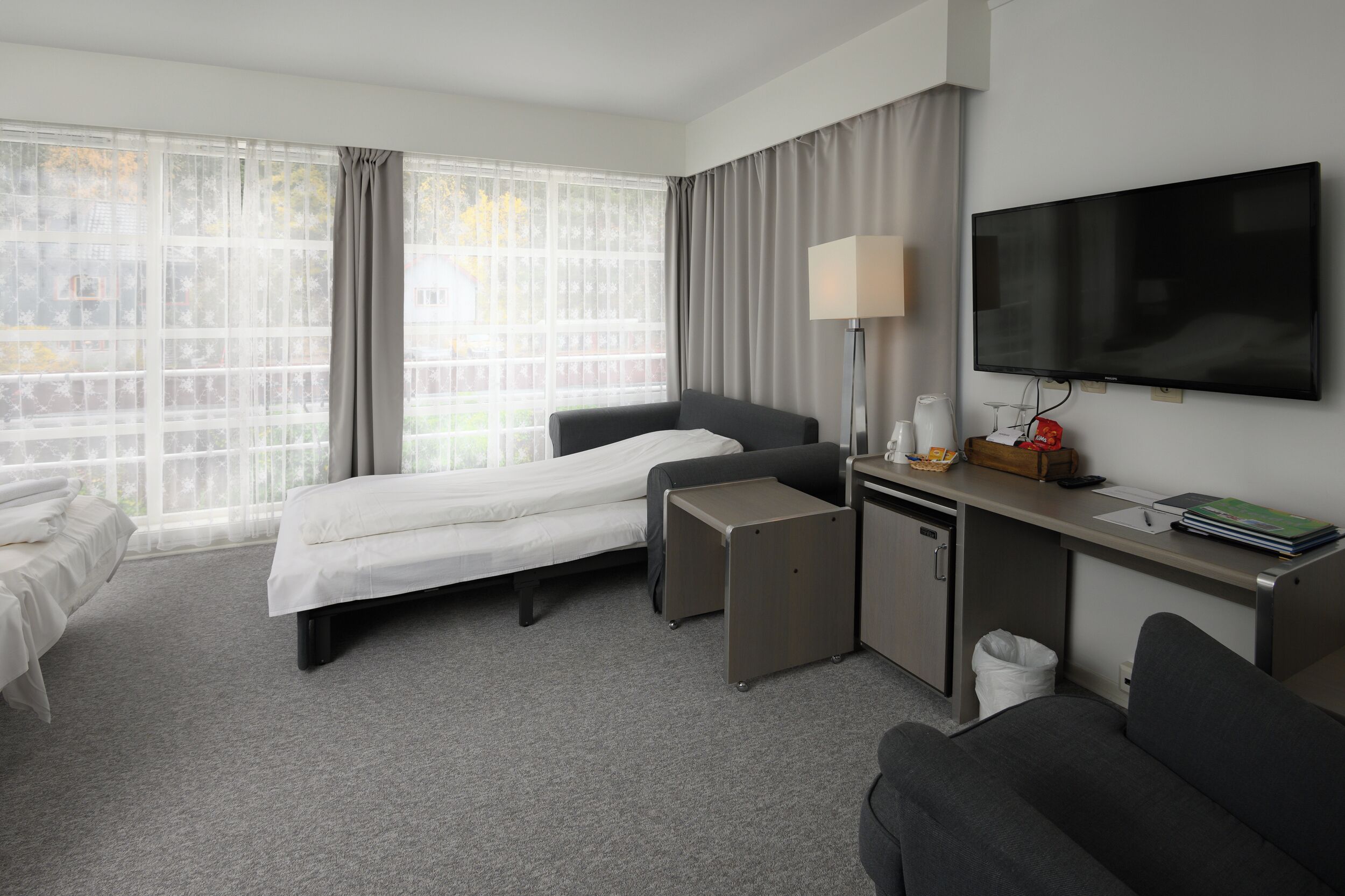 family room | desk, iron/ironing board, cots/infant beds, travel cot