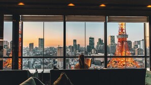 A room with large windows offering a view of a city skyline and a prominent tower. - The Prince Park Tower Tokyo - Preferred Hotels & Resorts, LVX Collection (Tokyo)
