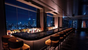 A bar with a city view, bar stools, and a long counter. - The Prince Park Tower Tokyo - Preferred Hotels & Resorts, LVX Collection (Tokyo)
