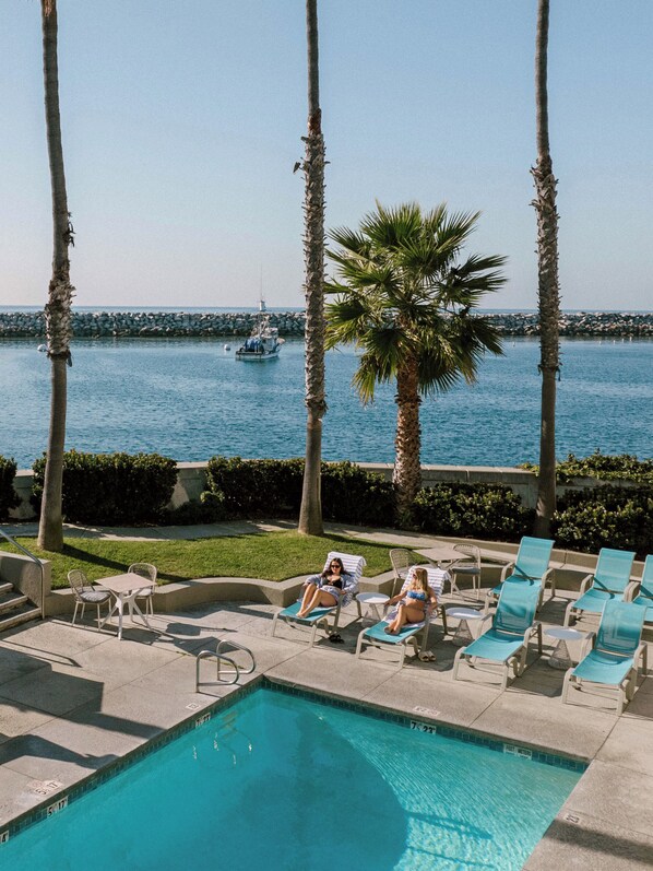 Outdoor pool, open 8:00 AM to 9:00 PM, pool umbrellas, pool loungers