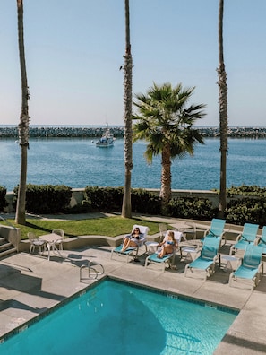Outdoor pool, open 8:00 AM to 9:00 PM, pool umbrellas, sun loungers