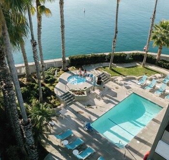 Outdoor pool, open 8:00 AM to 9:00 PM, pool umbrellas, sun loungers at Portofino Hotel & Marina