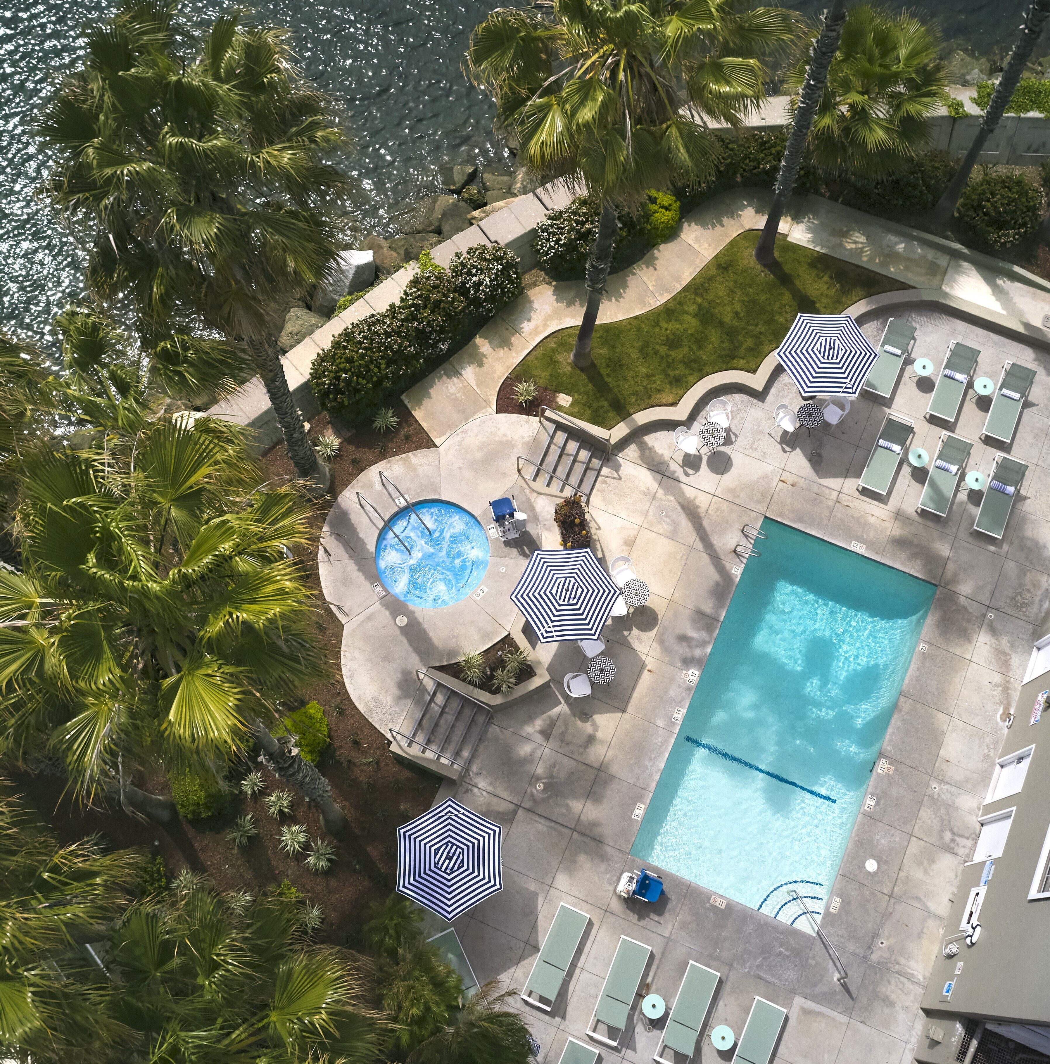 outdoor pool, open 8:00 am to 9:00 pm, pool umbrellas, pool loungers