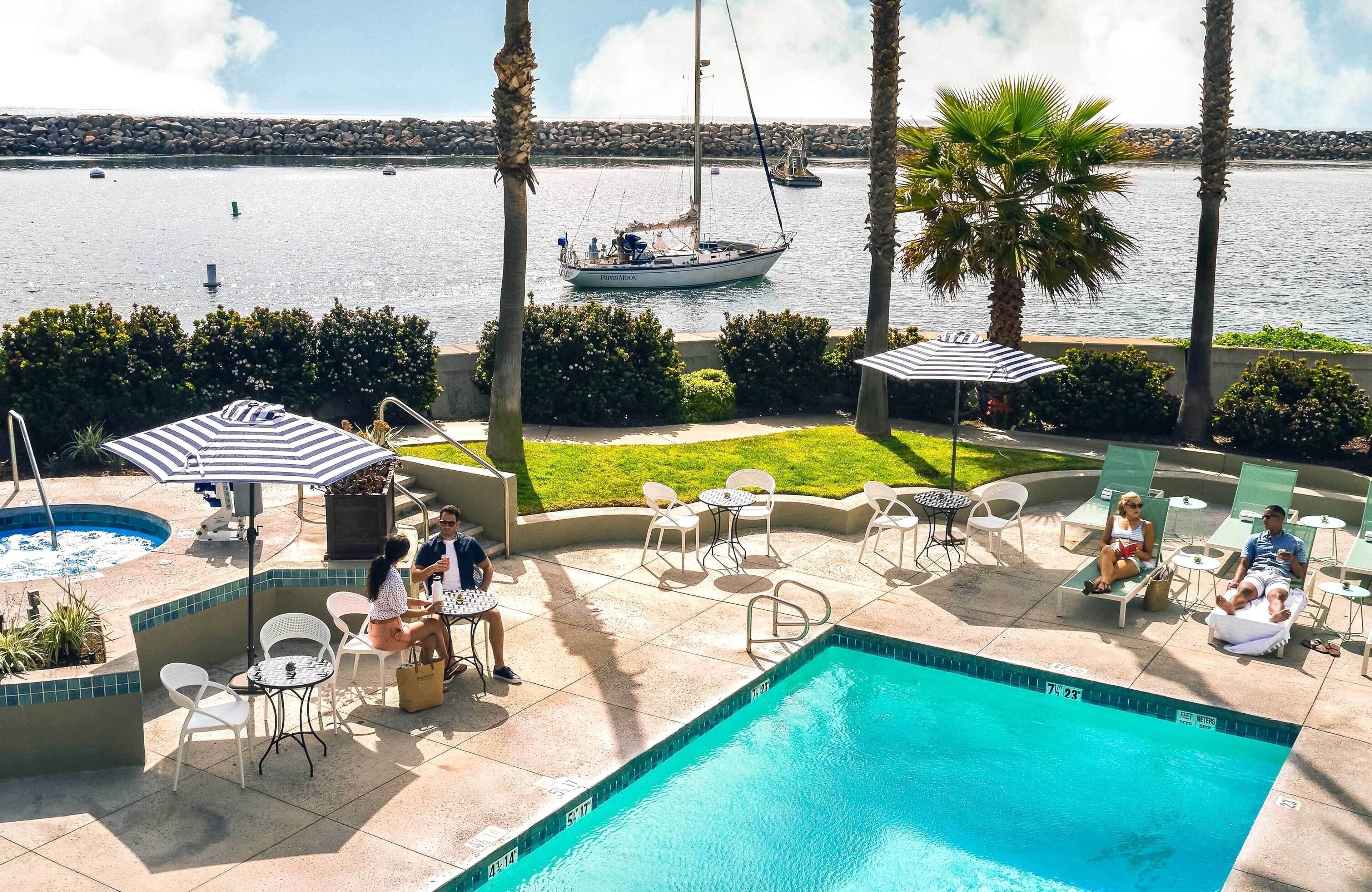 Outdoor pool, open 8:00 AM to 9:00 PM, pool umbrellas, sun loungers