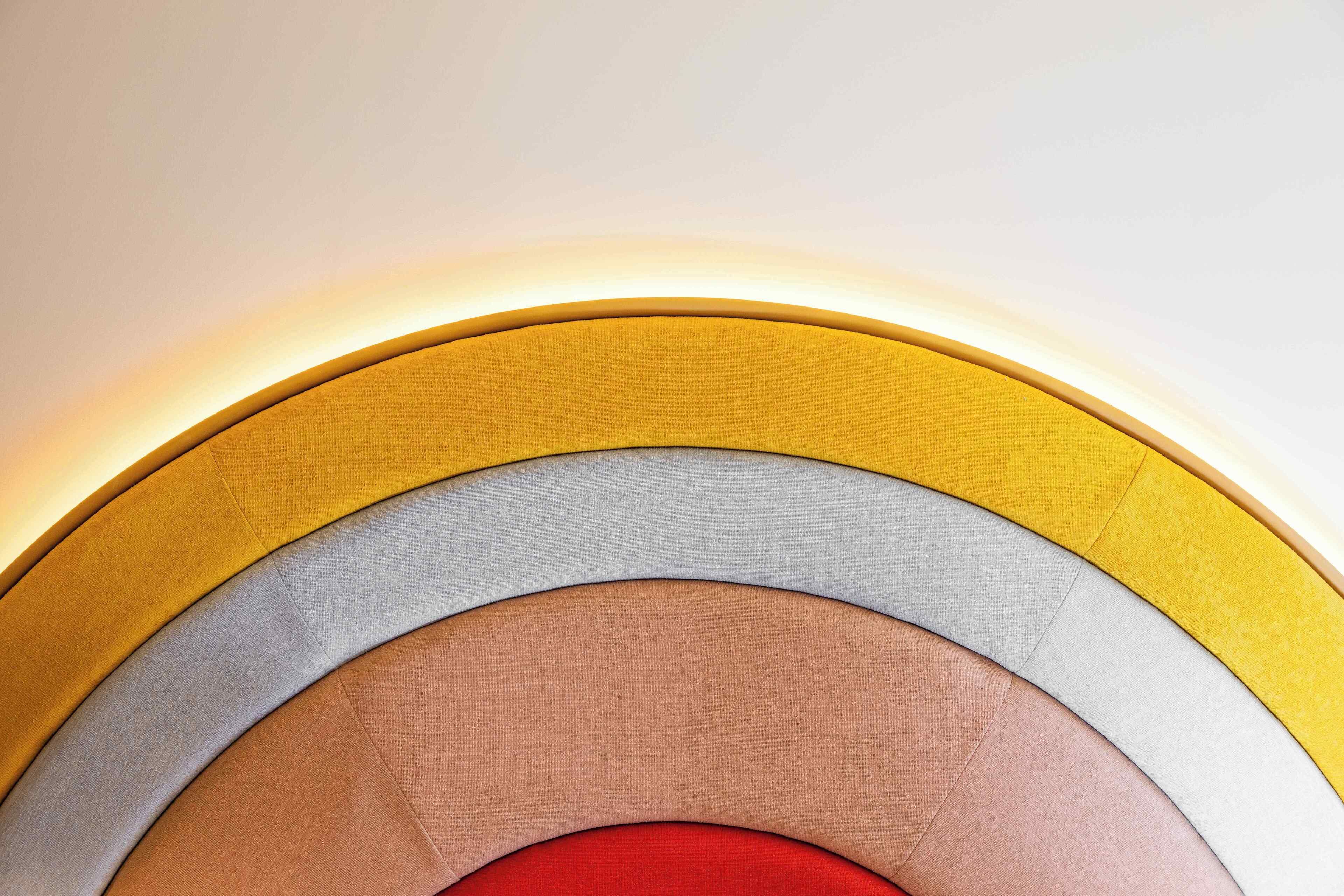 A circular arrangement of different colored fabric layers.