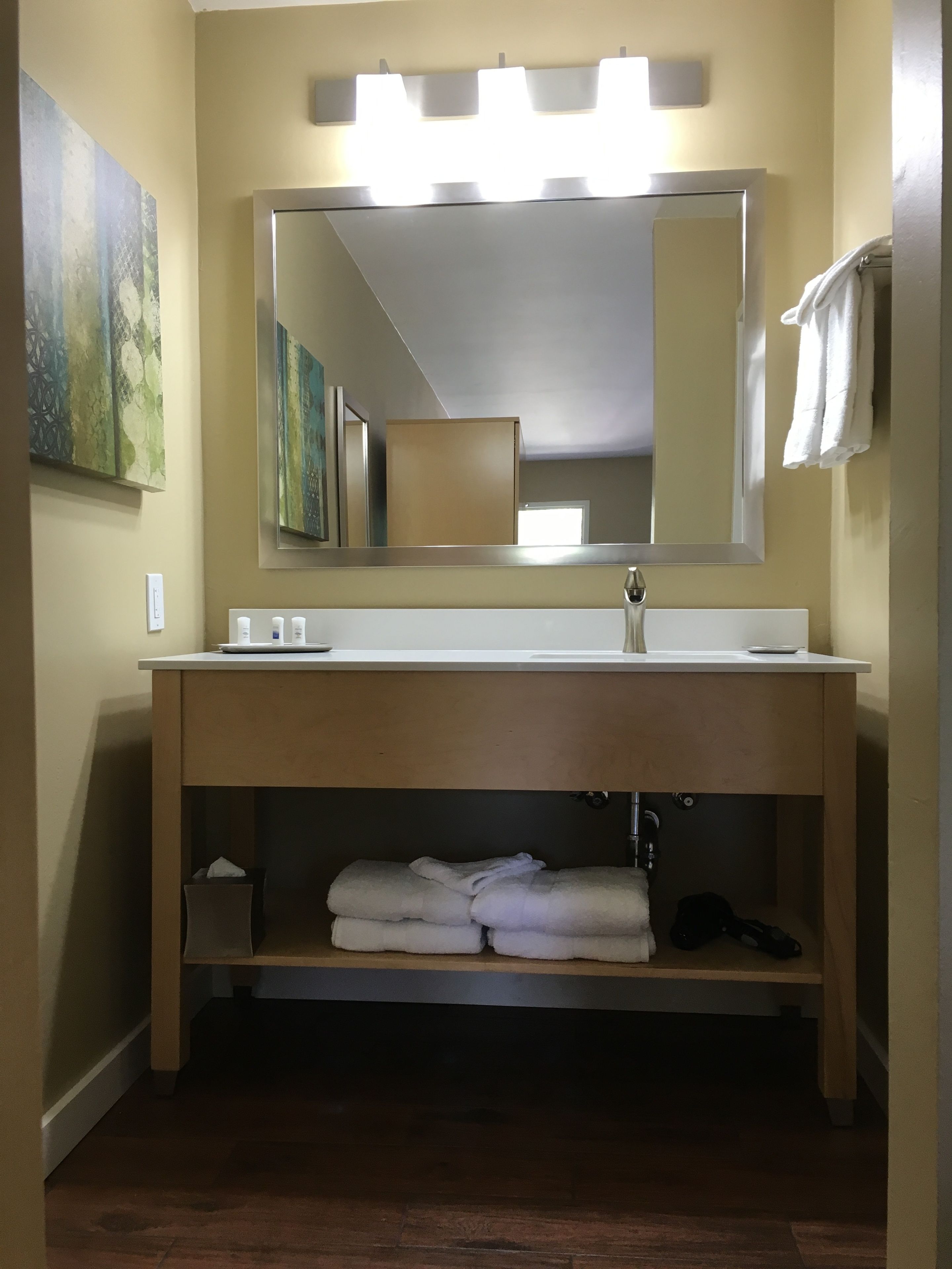 shower, designer toiletries, hair dryer, towels