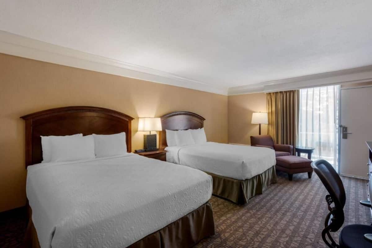 Premium bedding, pillow-top beds, desk, laptop workspace