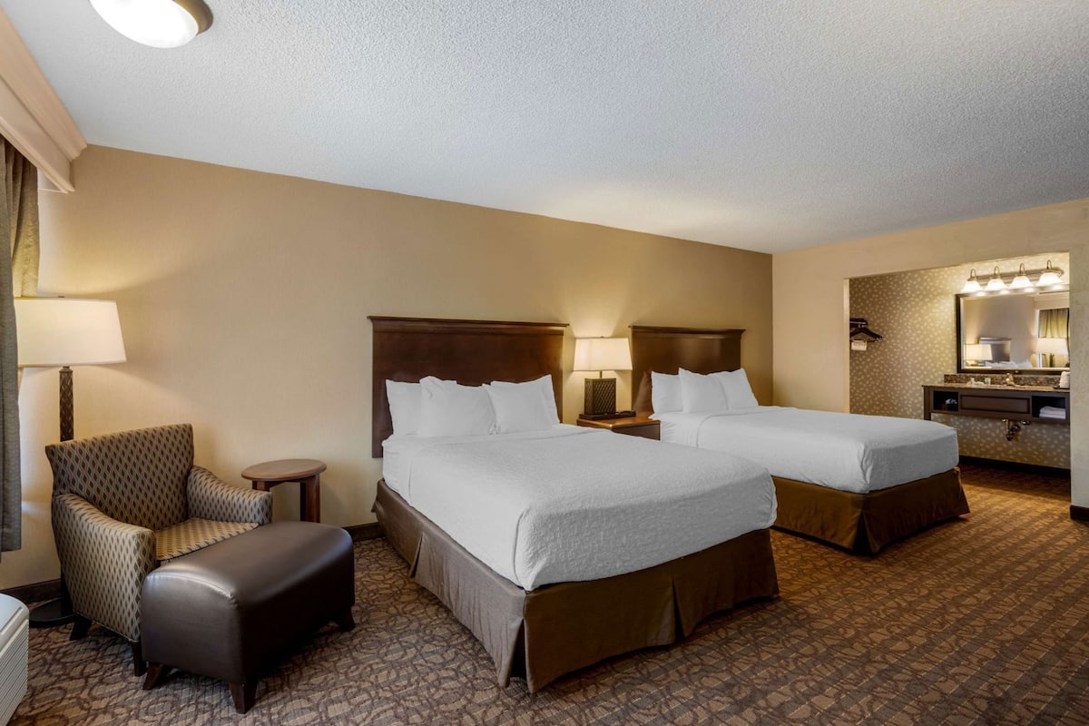 Premium bedding, pillow-top beds, desk, laptop workspace