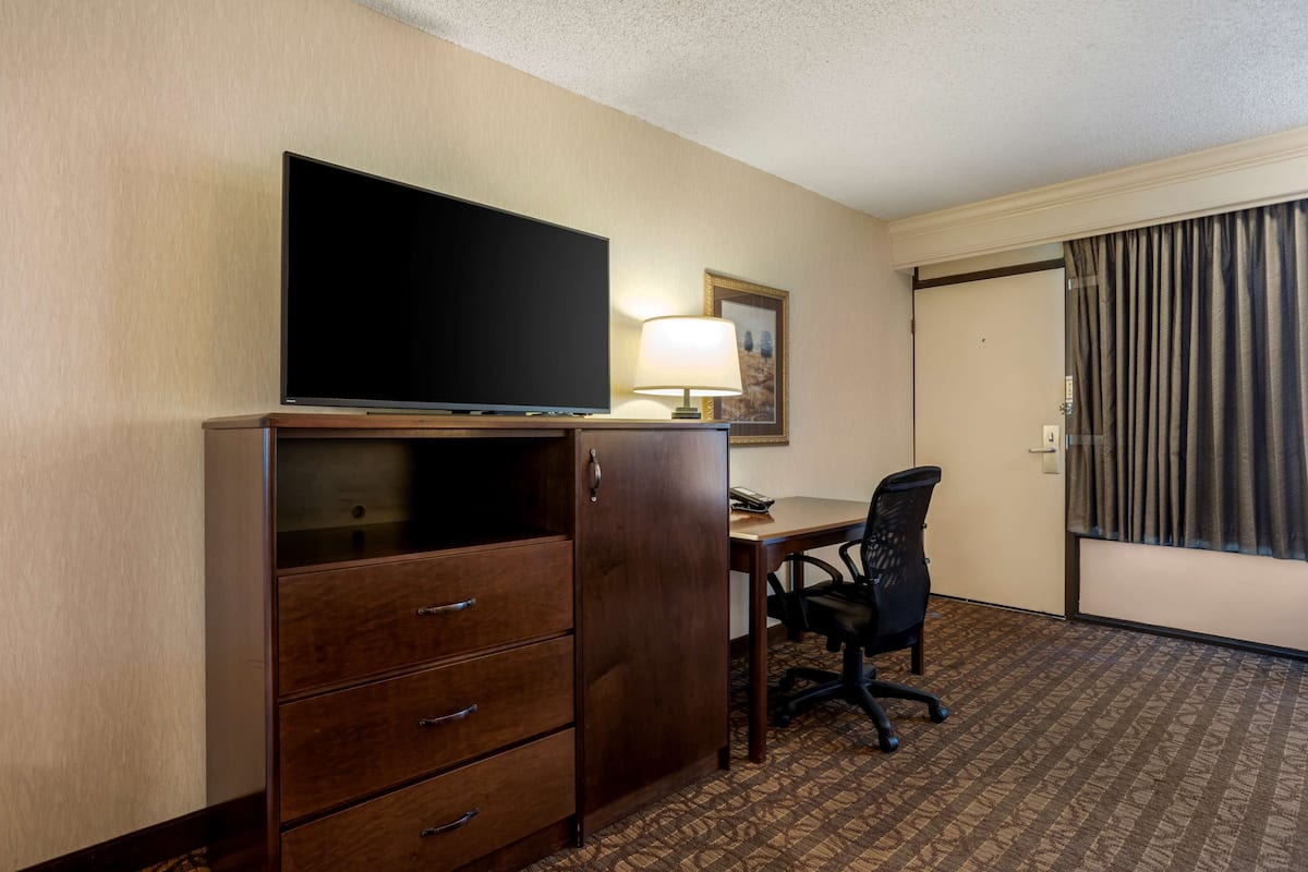 Premium bedding, pillow-top beds, desk, laptop workspace