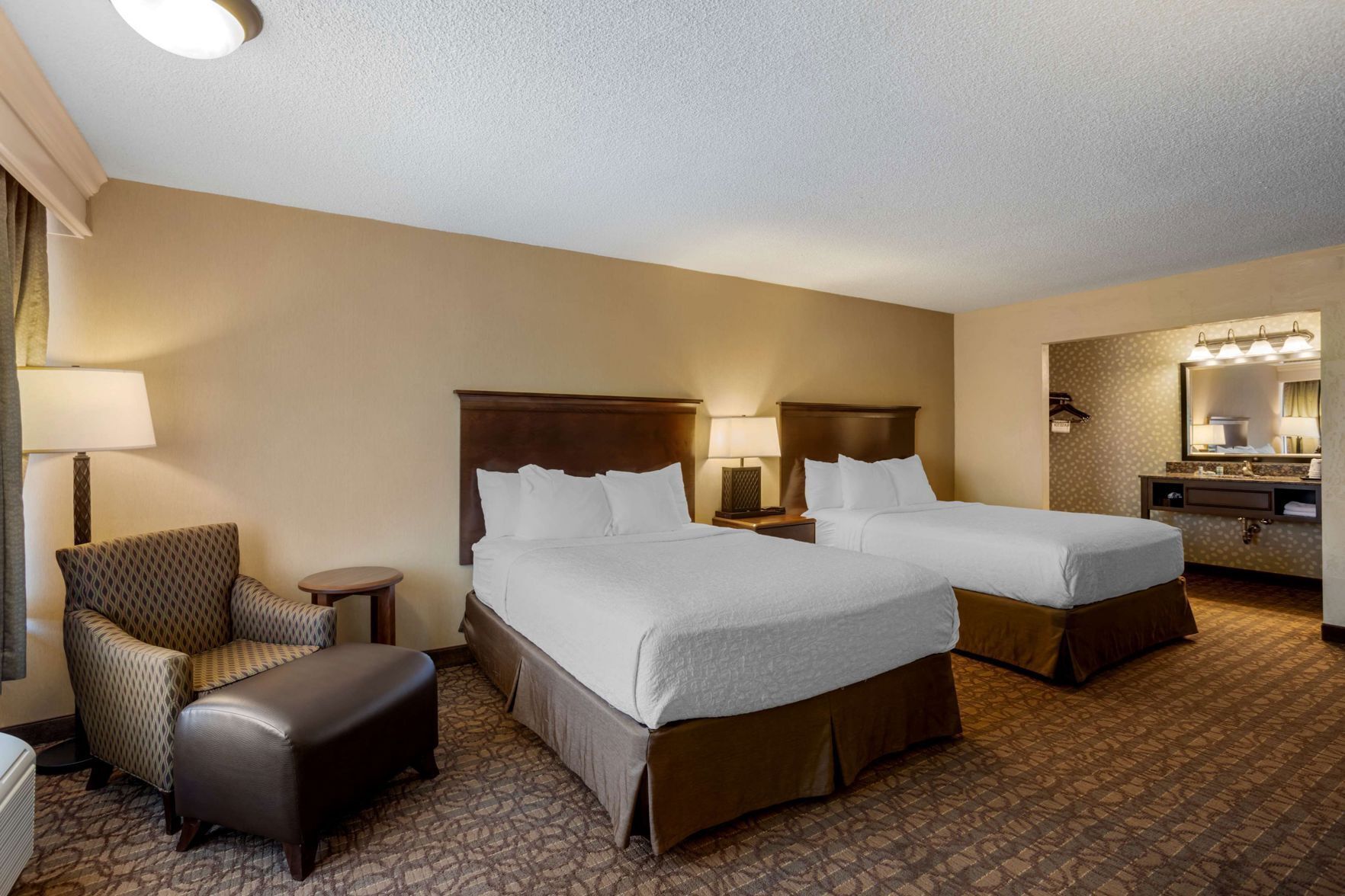 Premium bedding, pillowtop beds, desk, laptop workspace