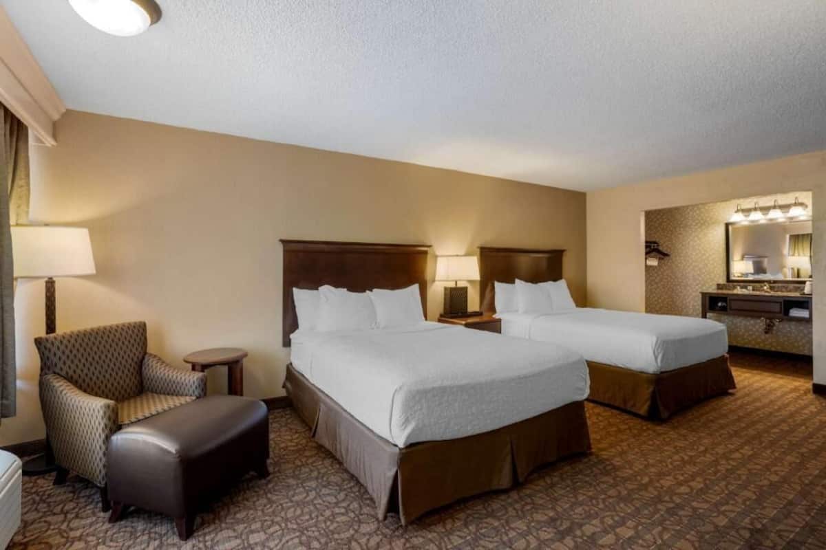 Premium bedding, pillow-top beds, desk, laptop workspace