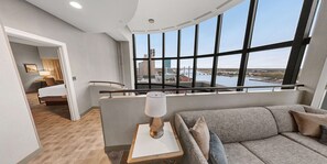Suite, 1 Bedroom | Living area | 49-inch TV with cable channels, Netflix, streaming services