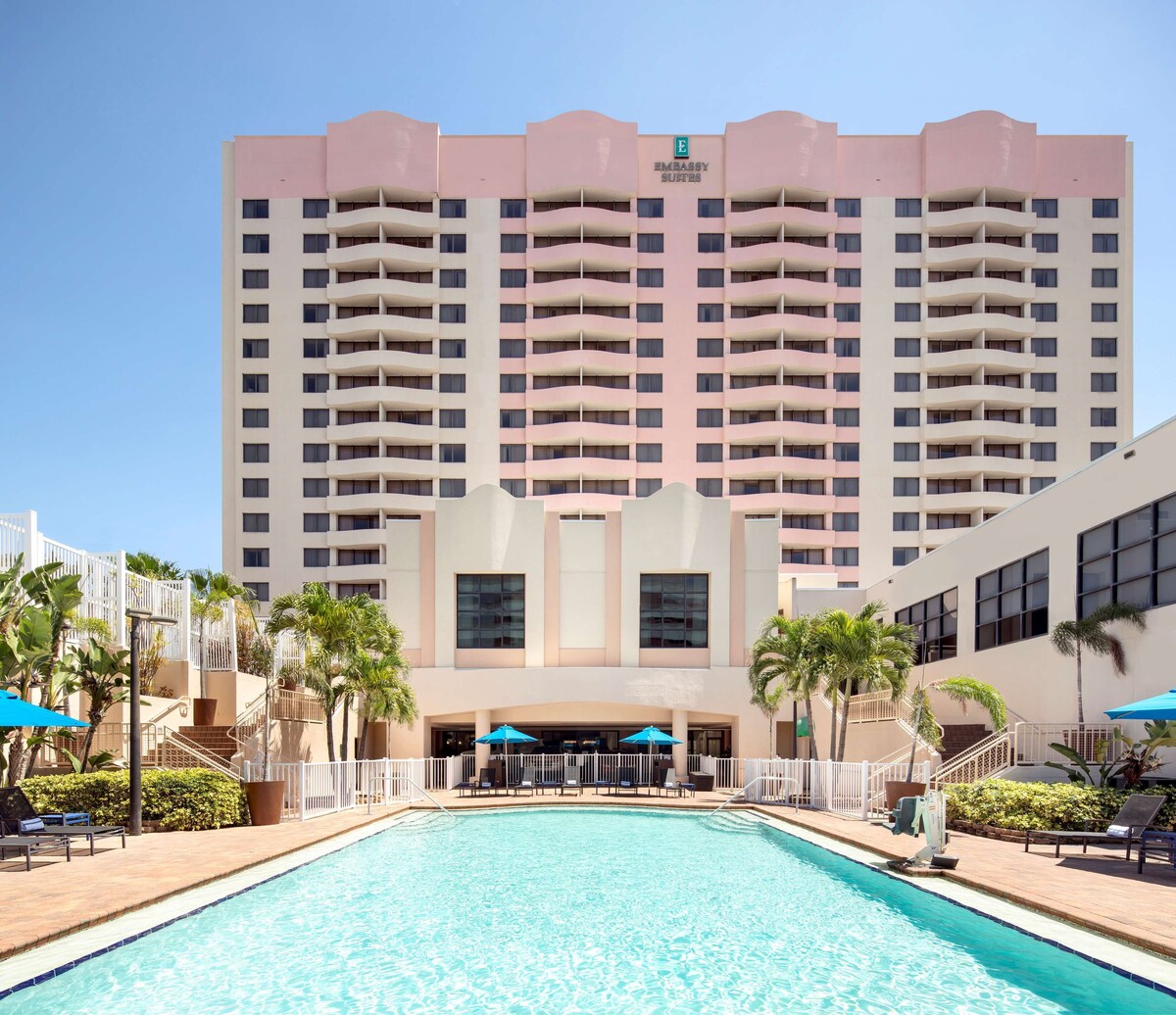 Beautiful outdoor pool & view of building at the Embassy Suites Tampa