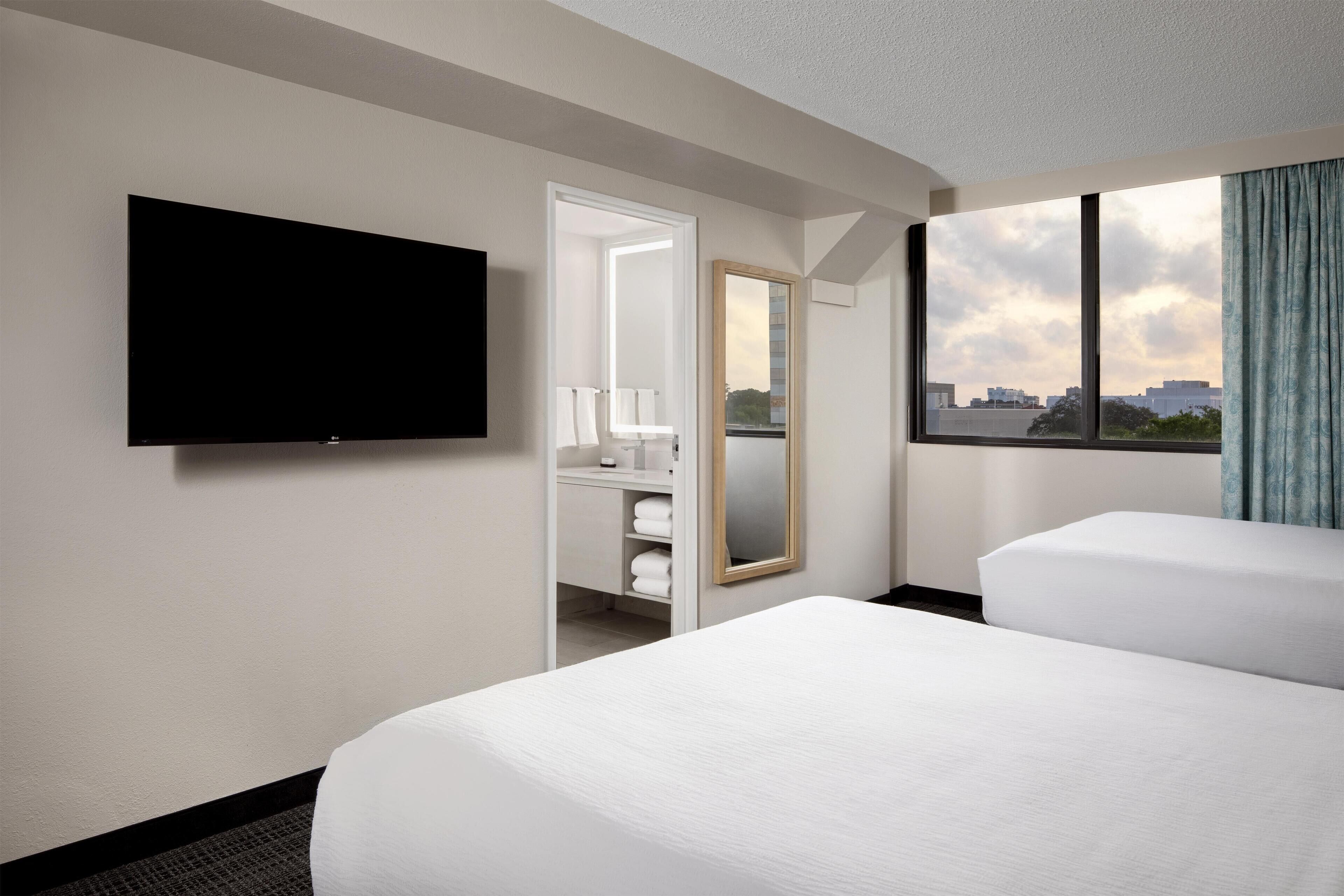 Suite, 2 Queen Beds, Corner | Premium bedding, in-room safe, iron/ironing board, WiFi